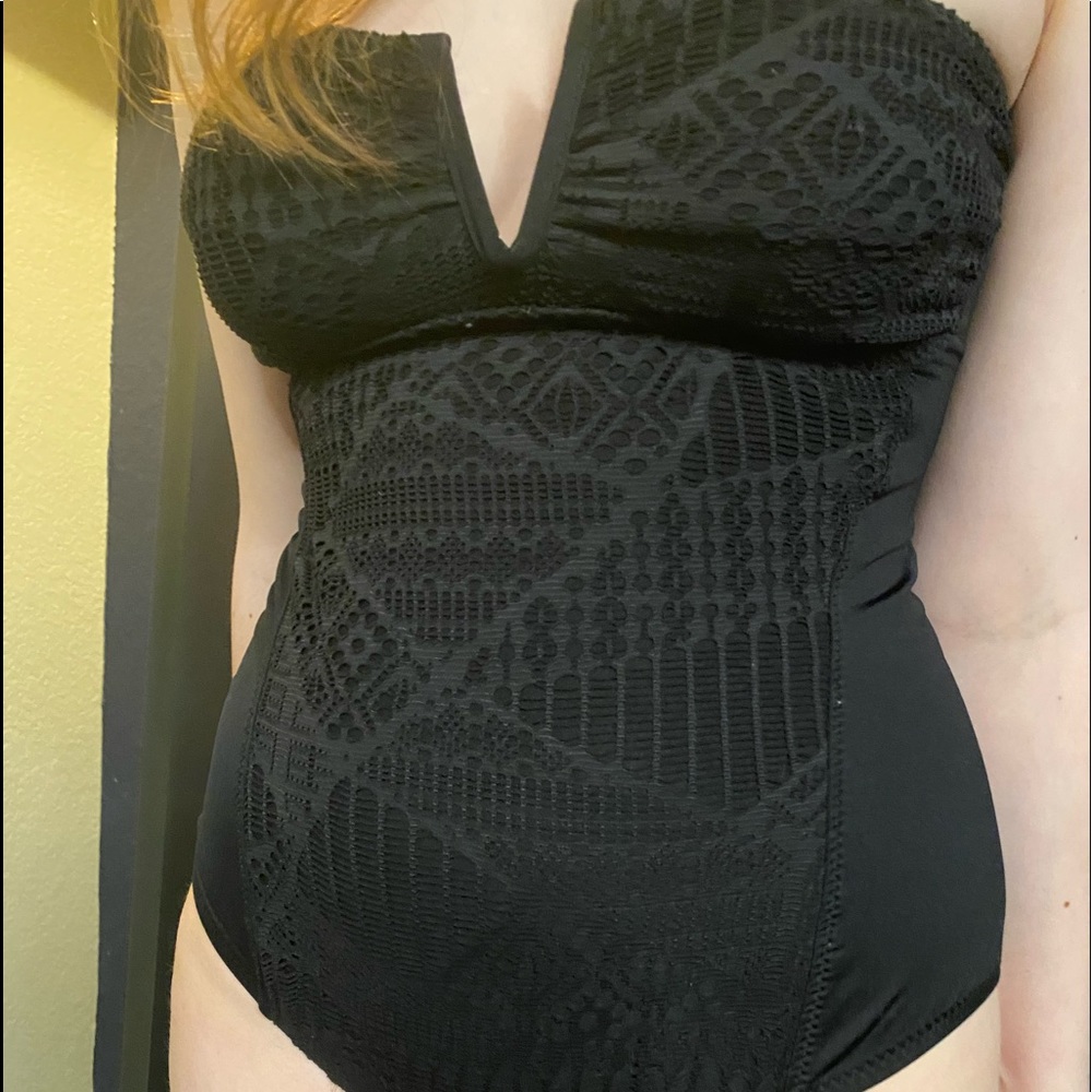 medium black one-piece swimsuit with designs